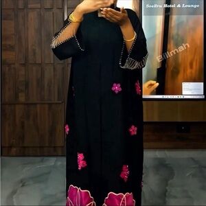 Elegant Black Dress with Pink Floral Accents